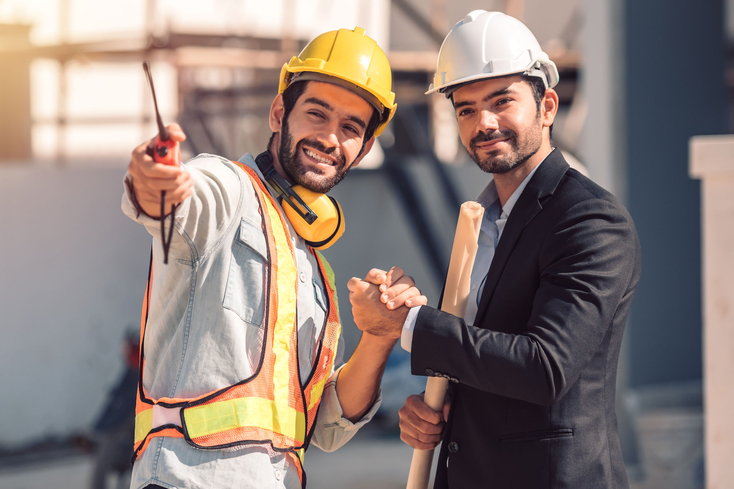 Handsome business man engineer in hard hat in a building